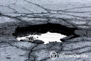 How to identify and repair pothole-related wheel damage